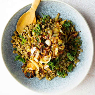 Mjadara a healthy Middle-eastern lentil dish in a pretty bowl.