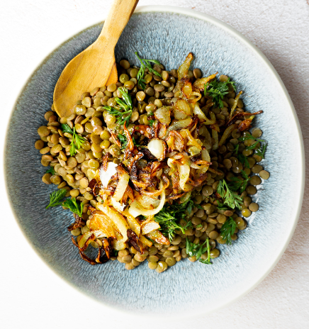 Mjadara a healthy Middle-eastern lentil dish in a pretty bowl.