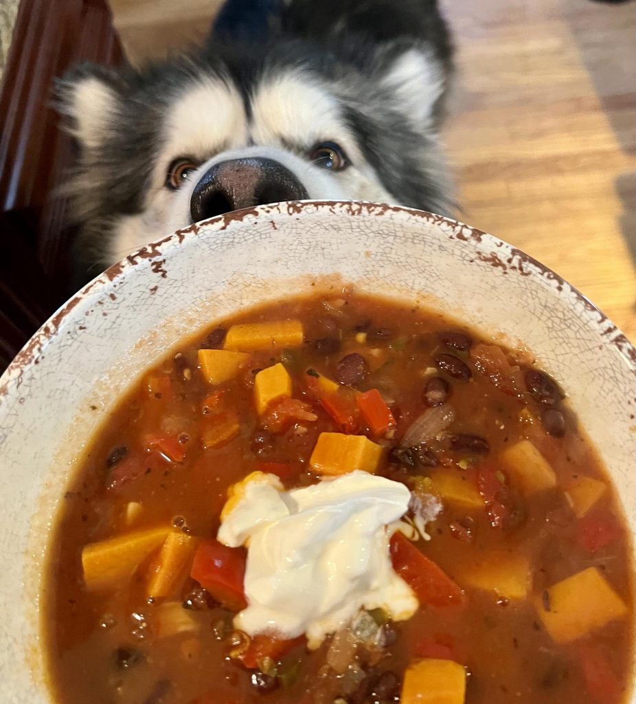 Picture of bowl of chili with sour cream on top.