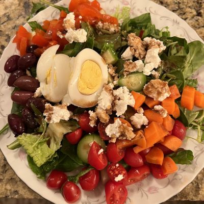 Colorful, healthy salad with homemade balsamic vinaigrette dressing.