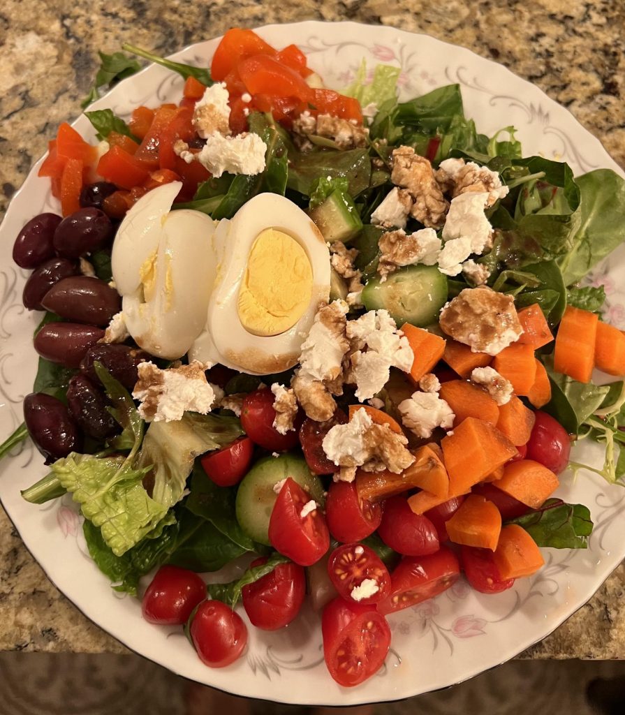 Colorful, healthy salad with homemade balsamic vinaigrette dressing.