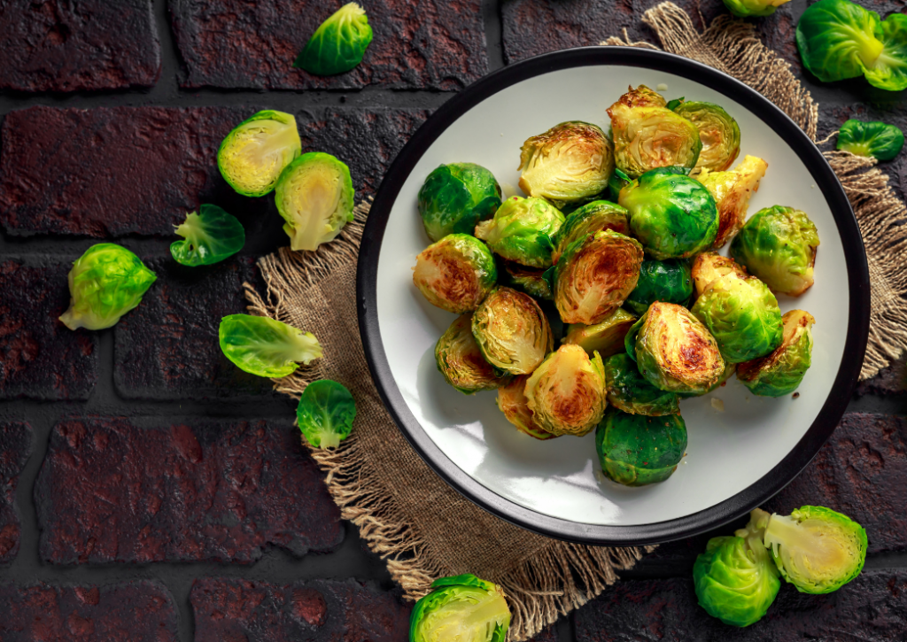 Roasted brussel sprouts on a pretty plate.