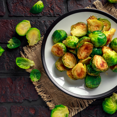 Roasted brussel sprouts on a pretty plate.