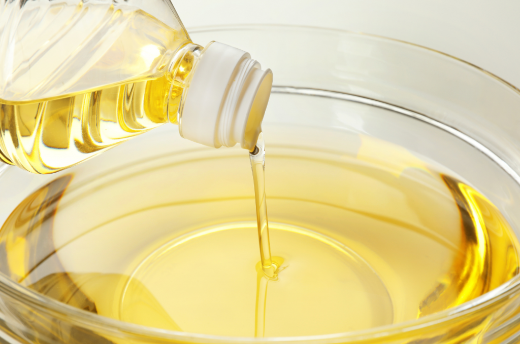 Cooking oil being poured into a bowl.