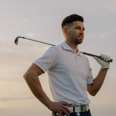 Fit man holding a golf club.