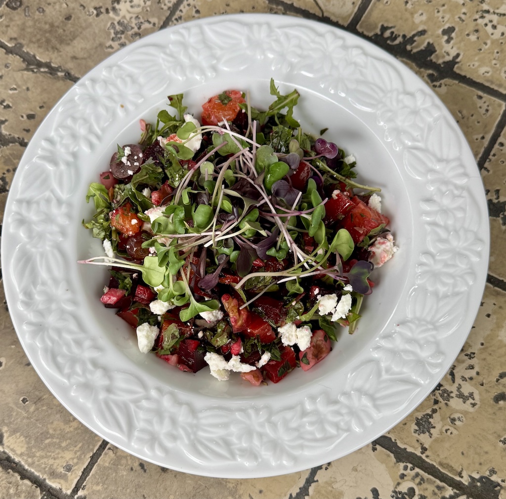 Beautiful salad with beets an goat cheese.